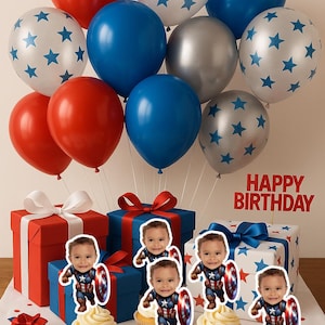May include: A festive birthday scene with red, blue, and silver balloons, some with star patterns. Gift boxes in red, white, and blue are tied with ribbons. Cupcakes topped with frosting and Captain America cutouts are arranged in front. The words "HAPPY BIRTHDAY" are displayed.