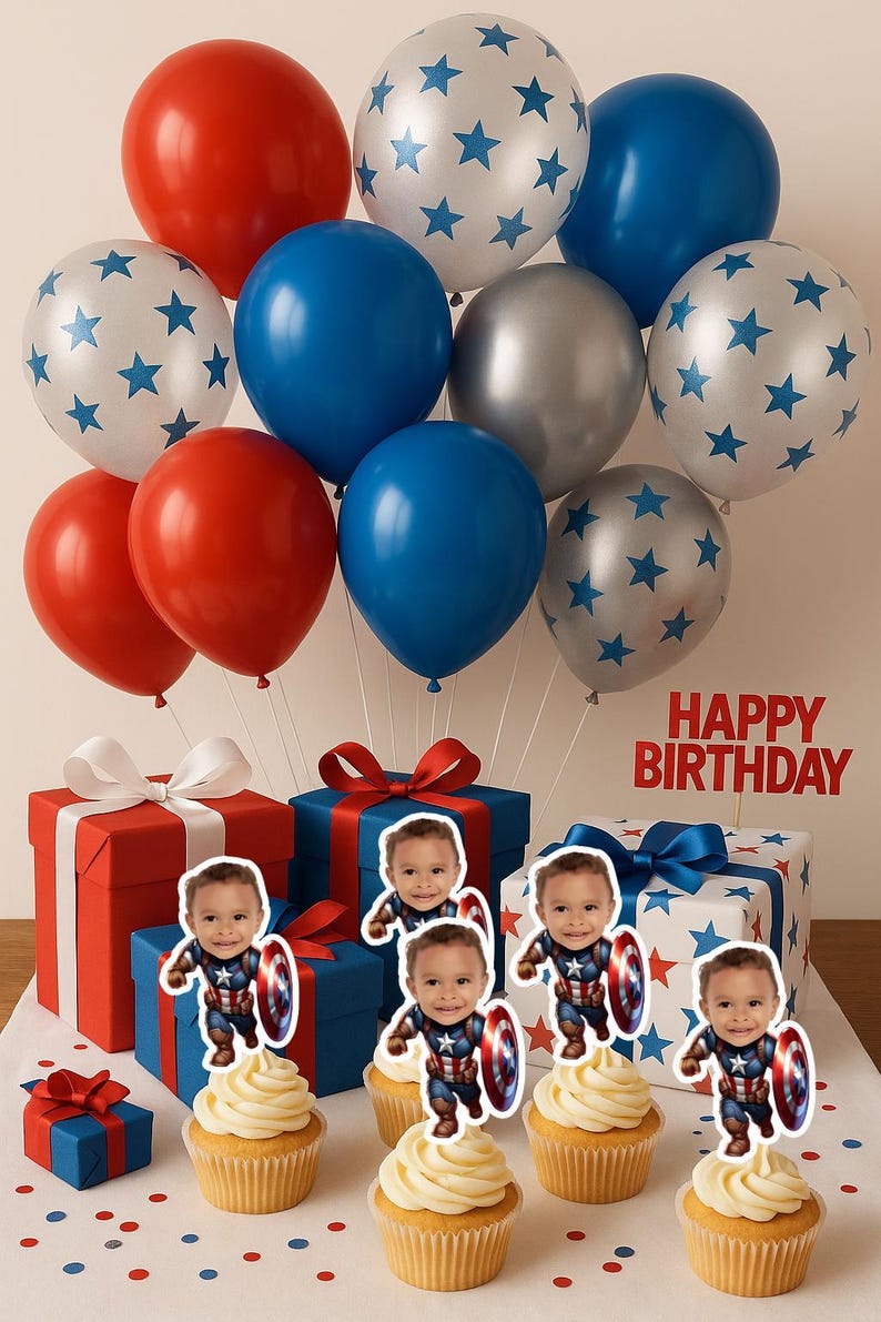 May include: A festive birthday scene with red, blue, and silver balloons, some with star patterns. Gift boxes in red, white, and blue are tied with ribbons. Cupcakes topped with frosting and Captain America cutouts are arranged in front. The words "HAPPY BIRTHDAY" are displayed.