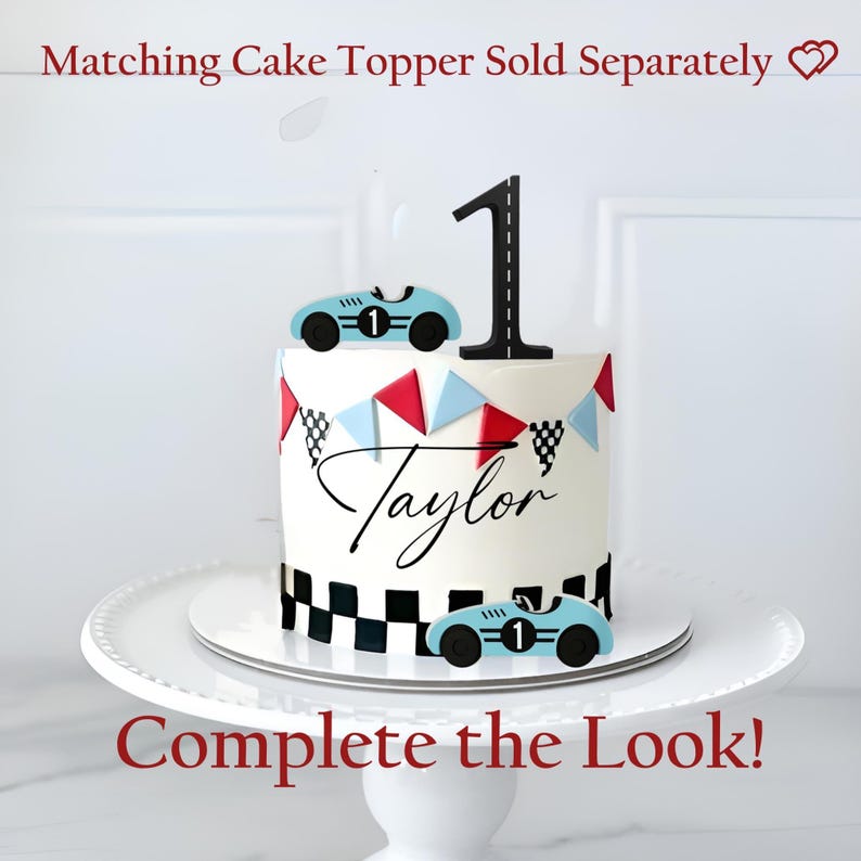 May include: A white cake with a black number one cake topper and two light blue race car toppers. The cake is decorated with red, blue, and black and white checkered flags and the name "Taylor". The cake sits on a white cake stand.