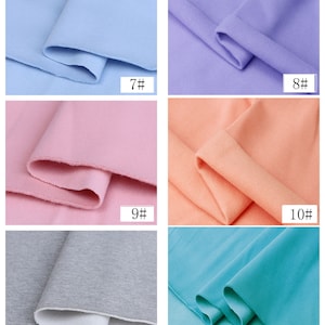 May include: Six fabric swatches in different colors: light blue, lavender, pink, peach, gray, and turquoise. Each swatch is folded in half and labeled with a number from 7 to 12.