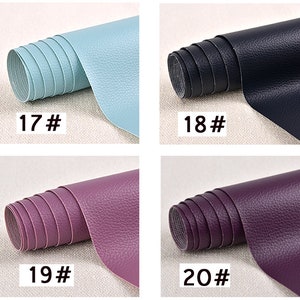May include: Four rolls of faux leather in different colors: light blue, dark blue, purple, and a darker shade of purple. Each roll is labeled with a number: 17, 18, 19, and 20.