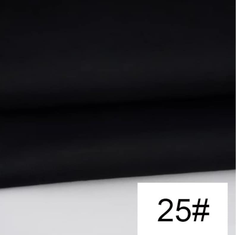 May include: Black fabric swatch with the number 25# printed on a white background.