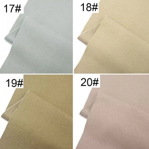 May include: Four fabric swatches in different colors: light blue, beige, khaki, and light pink. The swatches are labeled with numbers 17, 18, 19, and 20.