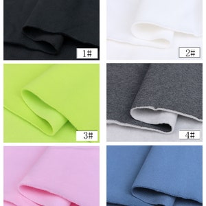 May include: Six fabric swatches in different colors: black, white, green, gray, pink, and blue. Each swatch is folded in half and labeled with a number from 1 to 6.