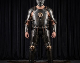 May include: A full suit of dark metallic armor featuring a chest plate with a central bronze-colored skull ornament, matching leg guards with skull knee caps, shoulder pauldrons, arm bracers, and a stylized face mask with a mustache and goatee.