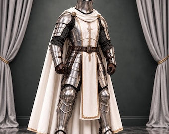 May include: A full suit of polished steel plate armor featuring a closed helmet, articulated shoulder and arm guards, and leg plating. A white tabard with gold trim is worn over the armor, paired with a long white cape and brown belt.