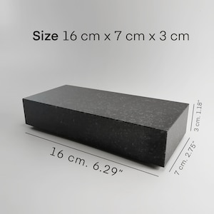 May include: A black rectangular granite slab measuring 6.29 inches by 2.75 inches by 1.18 inches. Size: 16 cm x 7 cm x 3 cm.