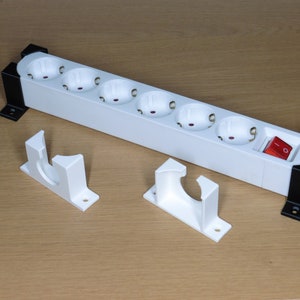 Power strip holder, wall or desk mounting