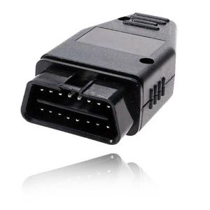 May include: A black OBD2 diagnostic connector featuring a trapezoidal shape with sixteen metal pins arranged in two rows. The plastic housing has a textured grip area on the top and sides, with a smooth rectangular panel on the upper surface.