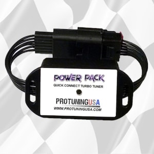 May include: A black Power Pack quick connect turbo tuner with the Pro Tuning USA logo. The device has a rectangular white label with black text and a black oval base. Black wires extend from the device.