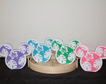 May include: Five wooden Mickey Mouse head cutouts with a tropical leaf and flower design. The cutouts are in purple, teal, green, pink, and white.