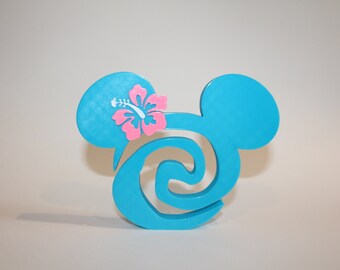 May include: A turquoise blue Mickey Mouse head silhouette with a pink hibiscus flower on the left ear. The silhouette is a stylized swirl design.
