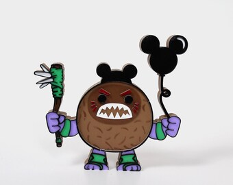 May include: A brown coconut character with a toothy grin, wearing a black Mickey Mouse hat and holding a green spiked club. The character is also holding a black Mickey Mouse balloon.