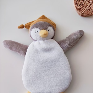 Flat cuddly toy penguin in fleece and soft taupe fabric for mixed boys and girls with personalized embroidery of the baby&#39;s first name