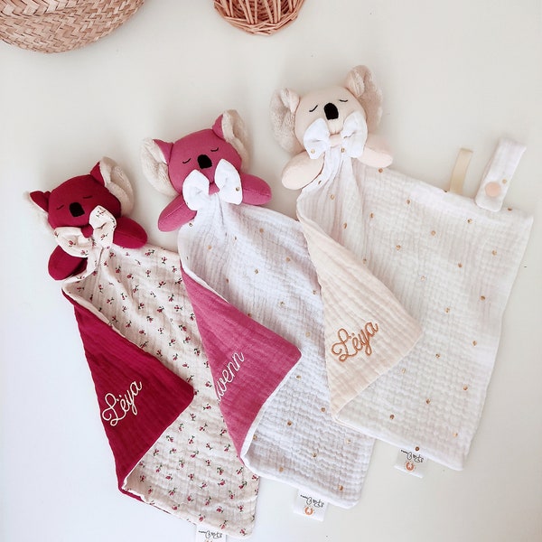 Pretty flat koala comforter in swaddle with label, small bow and personalized embroidery of baby girl or boy's first name