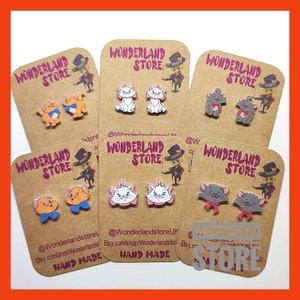 Cartoons Earrings. Size: Approx 10/15mm studs or 20/25mm dangles.