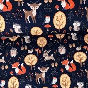May include: A dark blue fabric with a repeating pattern of woodland animals, including deer, foxes, owls, hedgehogs, rabbits, and birds. The pattern also includes trees, mushrooms, and leaves.