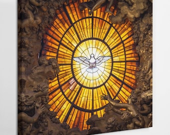 May include: A stained glass window depicting a dove with outstretched wings, surrounded by a circular pattern of golden rays. The dove is white and the rays are a warm yellow color. The window is set in a ceiling with a dark brown background.