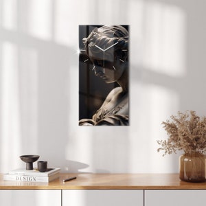 May include: A clock with a white face and black hands is superimposed on a black and white image of a woman's face. The woman is looking down and her face is partially obscured by her hair.