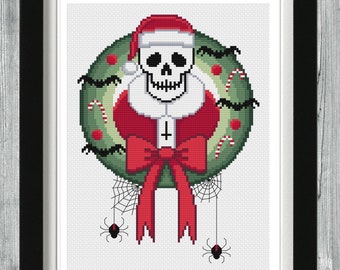 May include: A cross-stitch pattern featuring a skull wearing a Santa hat and a red bow, surrounded by a green wreath with candy canes and spiderwebs.