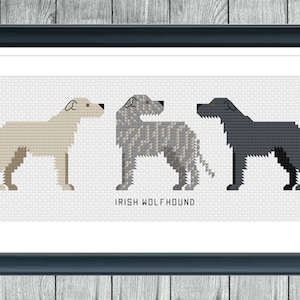 May include: A cross-stitch pattern featuring five Irish Wolfhounds in various colours, including black, grey, and white. The dogs are all standing in profile, with their heads turned to the side. The text "Irish Wolfhound" is printed below the dogs.