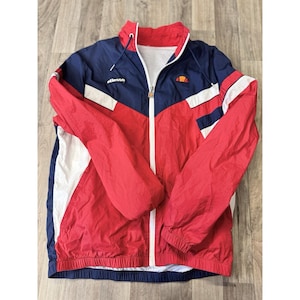 May include: A set of three ceramic mugs with a speckled, matte finish. The mugs are in shades of cream, light gray, and dark gray. Each mug has a simple, minimalist design and a rounded handle.