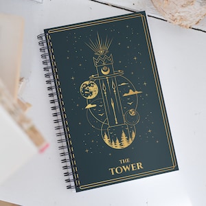 The Tower Tarot Card Journal with a Witchy Aesthetic Gold and Blue Tarot Blank Spiral Notebook
