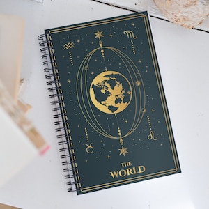 The World Tarot Card Journal with a Witchy Aesthetic Gold and Blue Tarot Blank Spiral Notebook