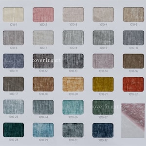 May include: A color chart of fabric swatches with numbers 1010-1 through 1010-32. The swatches are arranged in rows of five, with each swatch labeled with its corresponding number.