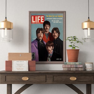 May include: A framed vintage magazine cover featuring a photo of the Beatles band members. The magazine is titled "LIFE" and the cover text reads "The New Far-out Beatles" and "Why Ma Stoon Fled China Part II".