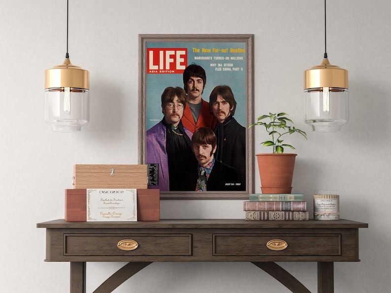 May include: A framed vintage magazine cover featuring a photo of the Beatles band members. The magazine is titled "LIFE" and the cover text reads "The New Far-out Beatles" and "Why Ma Stoon Fled China Part II".