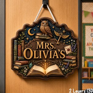 May include: A decorative wooden wall sign featuring the text "MRS. OLIVIA'S" in gold lettering. The design includes an owl perched on books, a winged key, an open book with glowing pages, and stacks of vintage books, all suspended by a white rope.