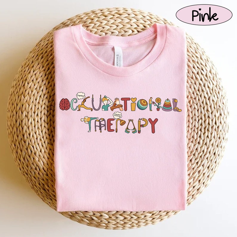 May include: Pink t-shirt with the words "Occupational Therapy" spelled out in colourful letters with illustrations of activities related to occupational therapy.