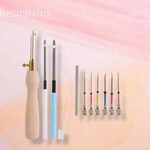 May include: A set of 10 resin art tools, including a wooden handled tool with a metal needle, two metal needles with white and blue handles, a metal needle with a clear handle, and six metal needles with coloured tips.