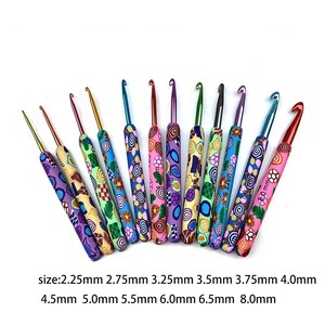 May include: Set of 12 colorful crochet hooks with different sizes ranging from 2.25 mm to 8.0 mm. Each hook has a unique patterned design.