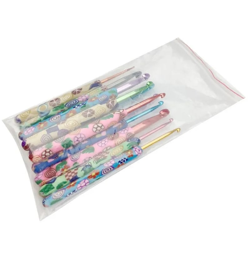 May include: A set of 10 colorful crochet hooks with patterned handles. The hooks are arranged in a plastic bag.