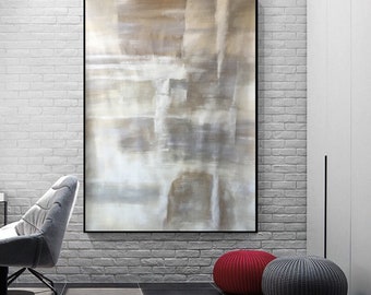May include: Abstract painting with a white and brown color scheme. The painting is framed in black and hangs on a white brick wall.