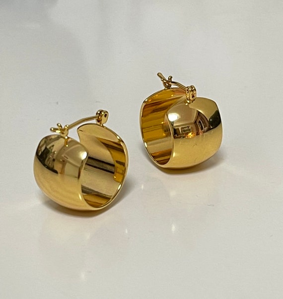 Wide gold 2024 huggie earrings