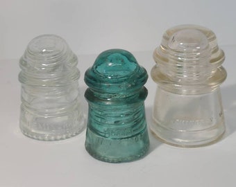 Antique Insulators. Hemingway clear glass 12, clear glass 16, blue glass No 9. Lot of three glass  Insulators.