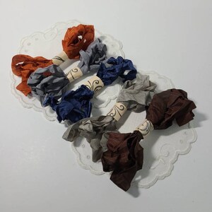 5 Yards Crinkled Seam Binding Ribbon. 1 Yard cuts of Assorted Rayon Crinkled Ribbon.