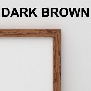 May include: A close-up of the corner of a dark brown wood picture frame.