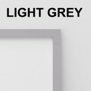 May include: A light grey picture frame with a white mat. The frame is made of wood and has a simple, modern design.