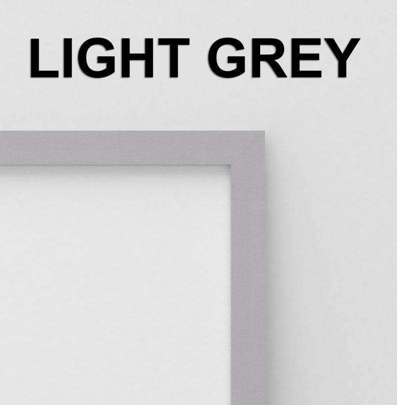 May include: A light grey picture frame with a white mat. The frame is made of wood and has a simple, modern design.