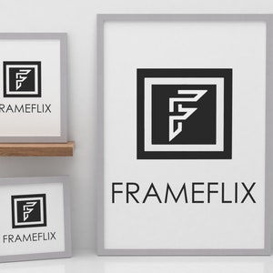 May include: Three grey picture frames with white mounts and a black and white logo of a stylised letter F inside a square. The logo is labelled "FRAMEFLIX" in black text.