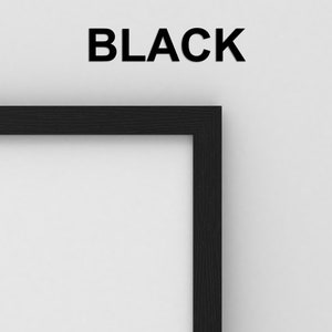 May include: Close-up of the top right corner of a black picture frame. The frame is made of wood and has a smooth finish.