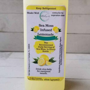May include: A yellow plastic bottle of Sea Moss Infused Lemonade with a white label. The label says "Keep Refrigerated", "Shake Well", "consume by expiration date", "Sea Moss Infused Lemonade", "The Recommended Daily Serving of Sea Moss In Every Bottle", "Drink 16oz daily for maximum benefit", "Do Not Consume More Than 32oz daily", "16oz (473ml)", and "Ingredients: Spring Water, Lemons, Sugar, Agave, Sea Moss and Seasonal fruit".