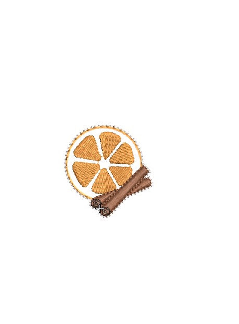 May include: An embroidered design featuring a sliced orange and two cinnamon sticks. The orange slice is segmented and has a white border. The cinnamon sticks are brown and positioned next to the orange slice. The design is on a white background.
