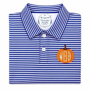 May include: A blue and white horizontally striped polo shirt featuring a three-button placket and a collar. An embroidered orange pumpkin with the white monogram letters WBB is on the chest. The inner neck label reads Nantucket Heights.