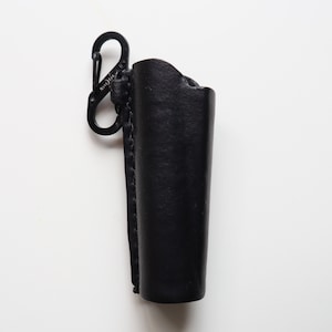 Leather cover for a Clipper lighter. Hand stitched, dyed, and wet formed. With S-carabiner.