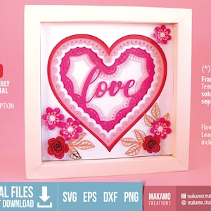 Puede incluir: Una descarga de archivo digital de un diseño de papelcraft en capas que presenta un corazón con la palabra "love" en su interior. El corazón está rodeado de capas rosadas y blancas con un borde festoneado. El diseño también incluye flores y hojas en rosa, rojo y dorado.